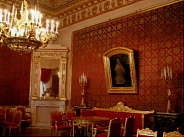 walls covered with red silk brocade